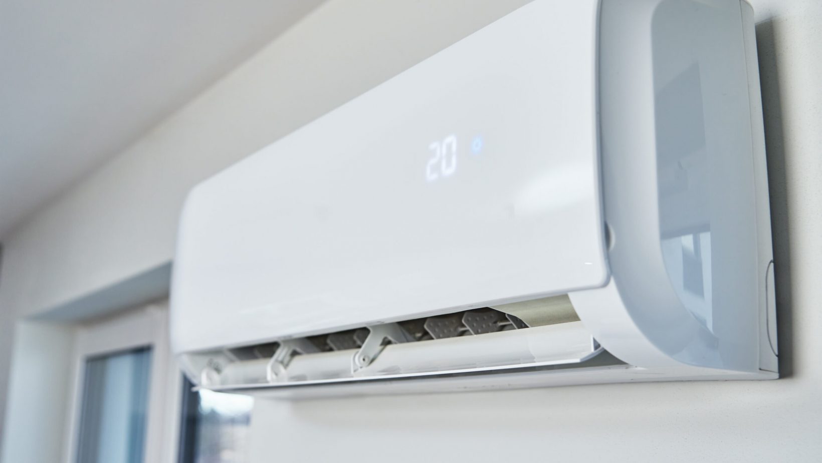 Adjusting temperature on air conditioner, Working air conditioner for comfort temperature in home at hot summer, cooling air in the room